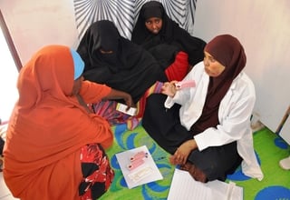 A midwife talks to girls about birth spacing at a youth firendly centre supported by UNFPA