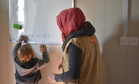 “Many women desire children, and face disappointment or even stigma if they cannot. A UNFPA-supported counselor watches over a refugee child in Iraq. © 2018/ UNFPA Iraq